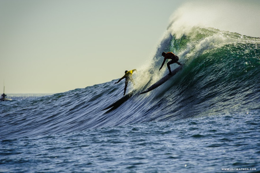 Two surfers at Mavericks. Half Moon Bay, CA