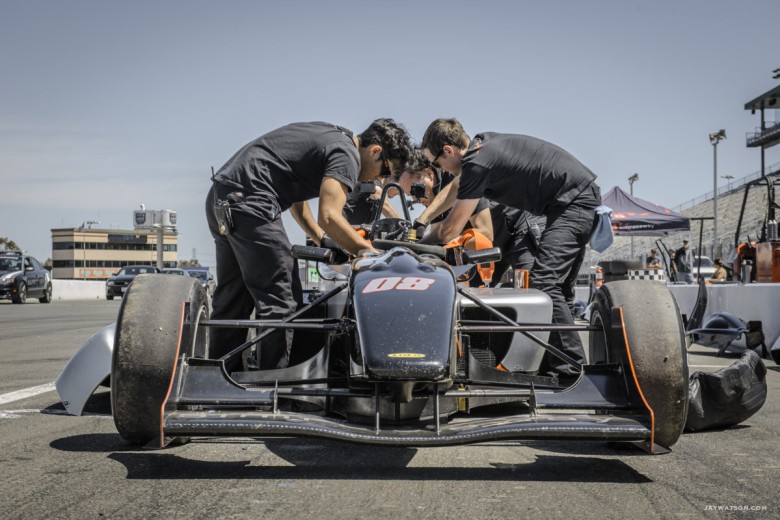 Tech team preparing an F3 race car between practice laps. Sonoma Raceway
