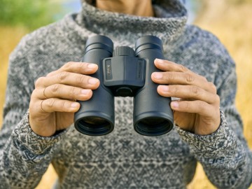 Lifestyle product shot of the Monarch M5  binoculars. | Nikon USA