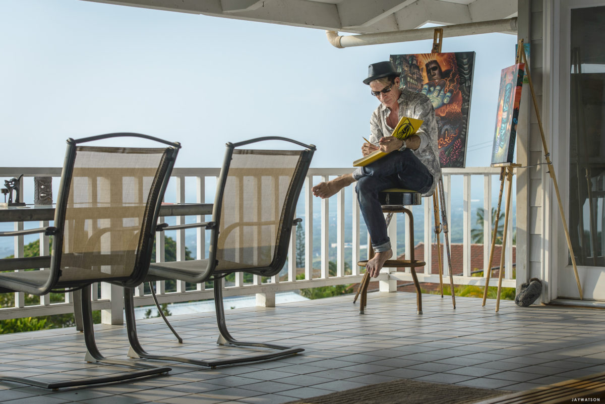 Tiki artist Brad Parker working at home.